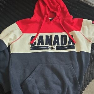 Red and Cream Hoodie with Canada Embroidered Front. Like New